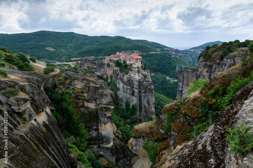 Beautiful scenic view of Meteora monasteries built on natural conglomerate pillars, at the northwestern edge of the Plain of Thessaly near the Pineios river and Pindus Mountains, Greece.
