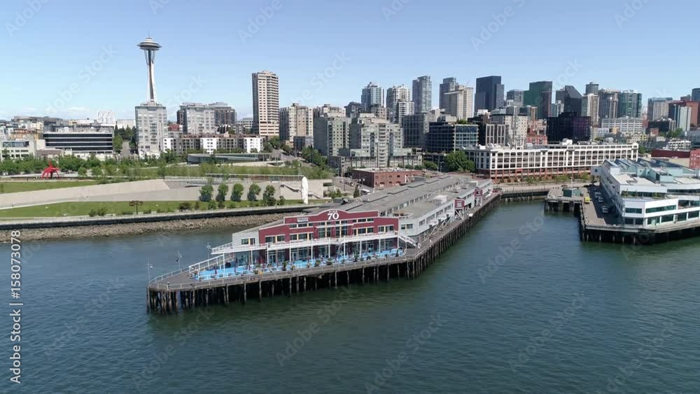 Aerial Dolly Across Downtown Seattle Buildings and Waterfront Pier 70 on Sunny Day with Blue Sky Aerial Dolly Across Downtown Seattle Buildings and Waterfront Pier 70 on Sunny Day with Blue Sky