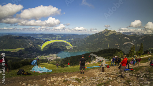 View From 12er Horn Mountaintop With Stunning View Over The Landscape And Some Paragliders photo