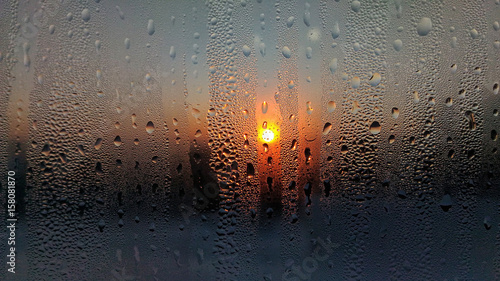 Sunset over the gulf of Thailand through a ferry window spayed with salt water