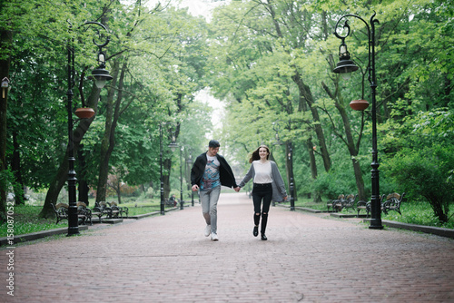 Wallpaper Mural lovely cople  running and play in the park Torontodigital.ca