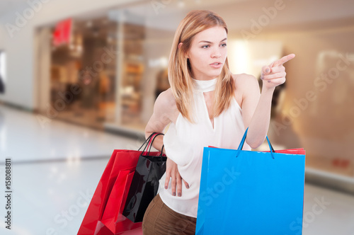 Stylish shopper at the mall with gift bags