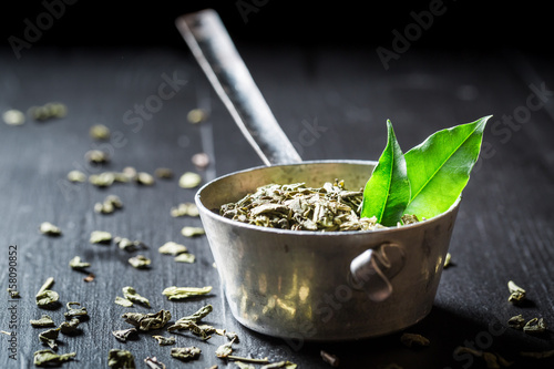 Tasty green tea on black wooden table