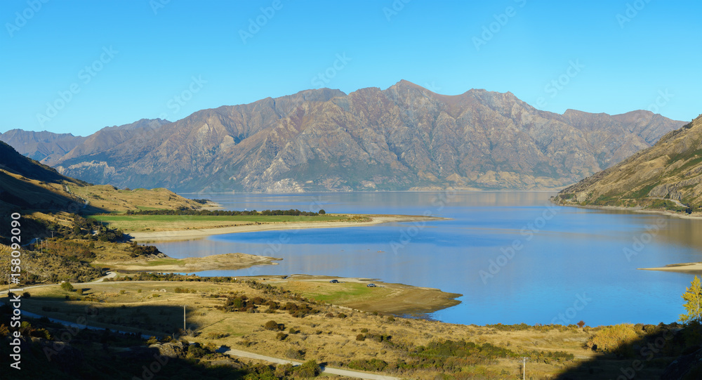 Panoramic image of Lake Hawea in clear blue sky , Queenstown-Lakes District , South Island of New Zealand