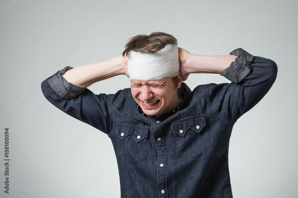 Man with bandage on his head Man with bandage on his head