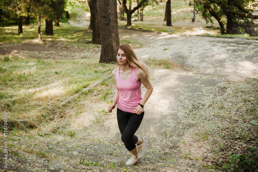 Sporty girl running in the park