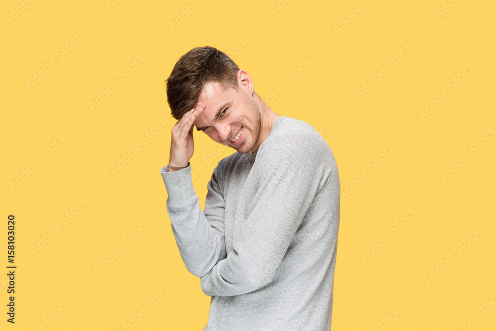 The young man smiling and looking at camera The young man smiling and looking at camera