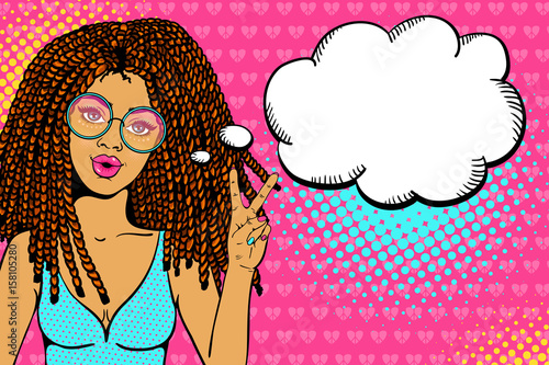 Pop art female face. Sexy young hippie woman with dreadlocks in round glasses shows victory sign and empty speech bubble. Vector colorful background in pop art retro comic style.