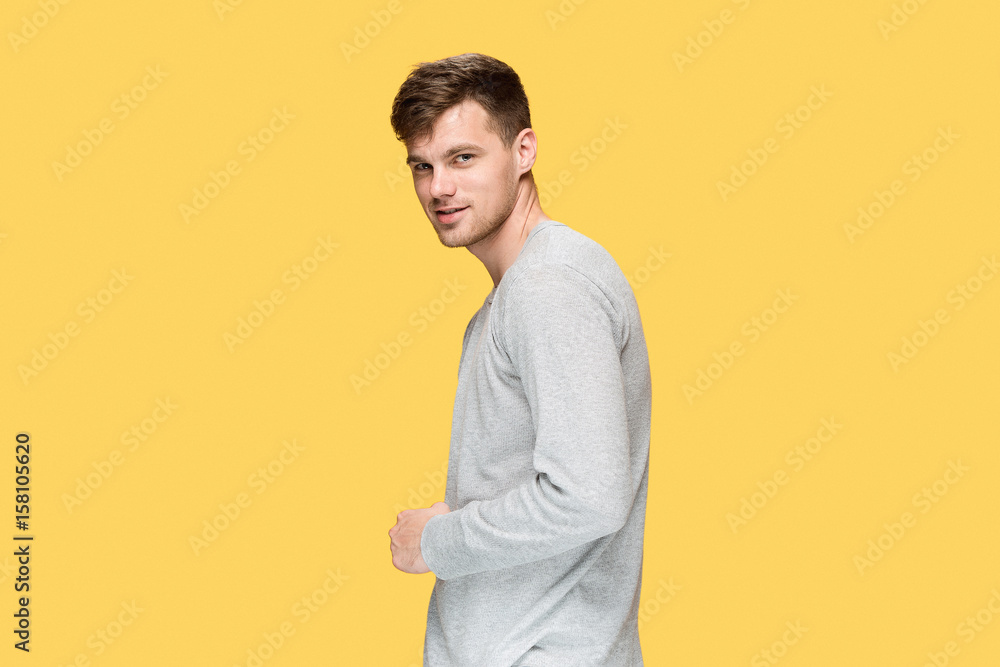 The young man smiling and looking at camera The young man smiling and looking at camera