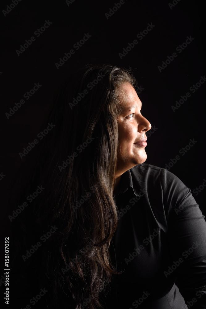 Portrait of a latin woman on black background Portrait of a latin woman on black background