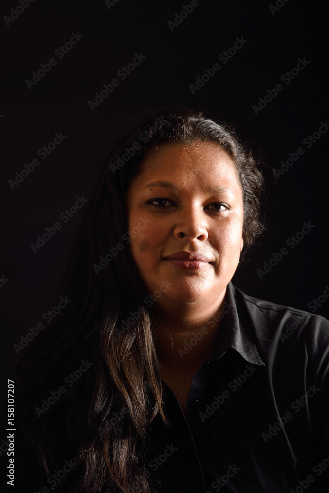 Portrait of a latin woman on black background Portrait of a latin woman on black background