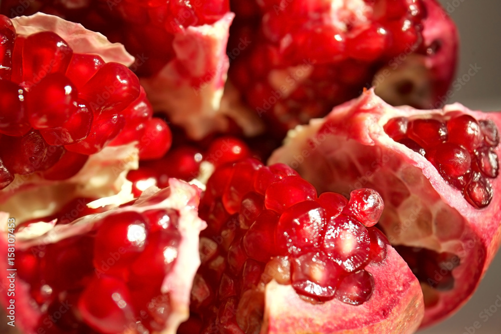 Fresh juicy pomegranate, closeup Fresh juicy pomegranate, closeup