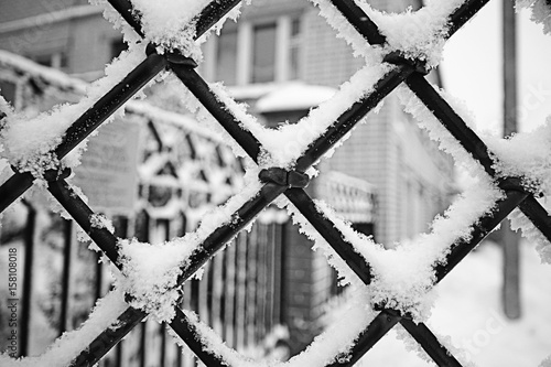 steel grate covered with snow background