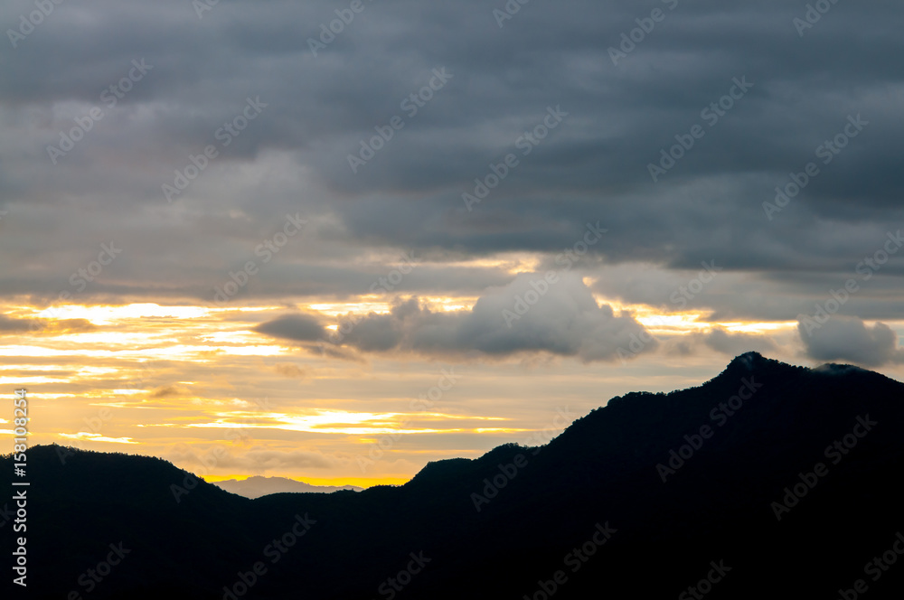 Landscape of sunrise and foggy over the mountain.