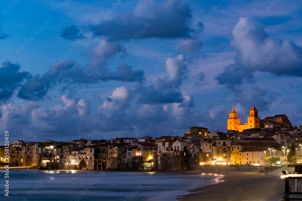 Touristic and vacation pearl of Sicily, small town of Cefalu at night, Sicily, south Italy, sea view, sunset