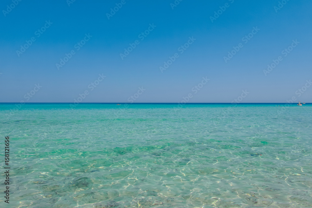 Vacation on the sea, Crystal clear sea water texture with glare from the sun - obrazy, fototapety, plakaty 