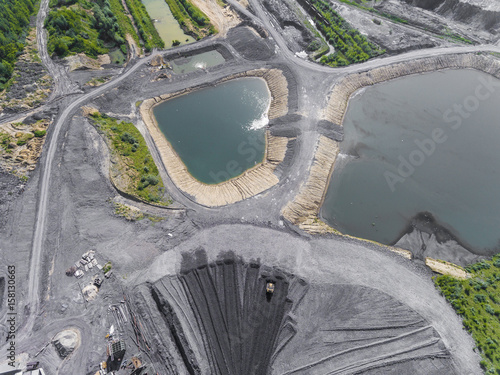 Black coal deposits. Exploration and machine. View from above.