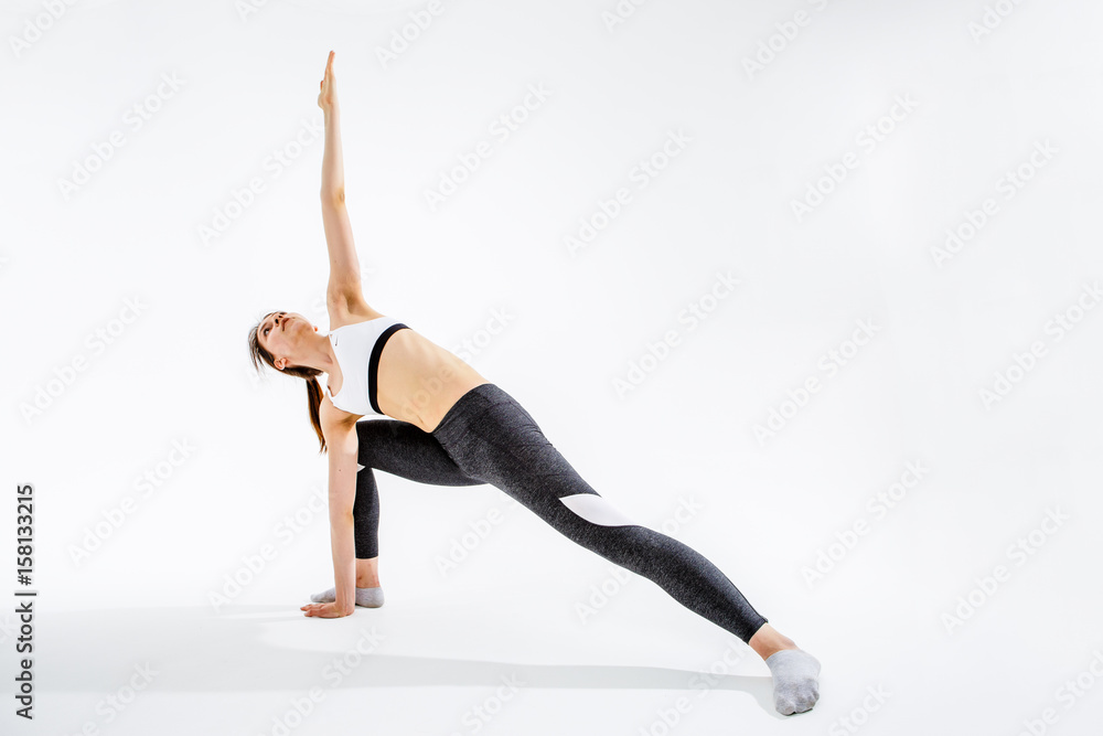 Young woman engaged in gymnastics Young woman engaged in gymnastics