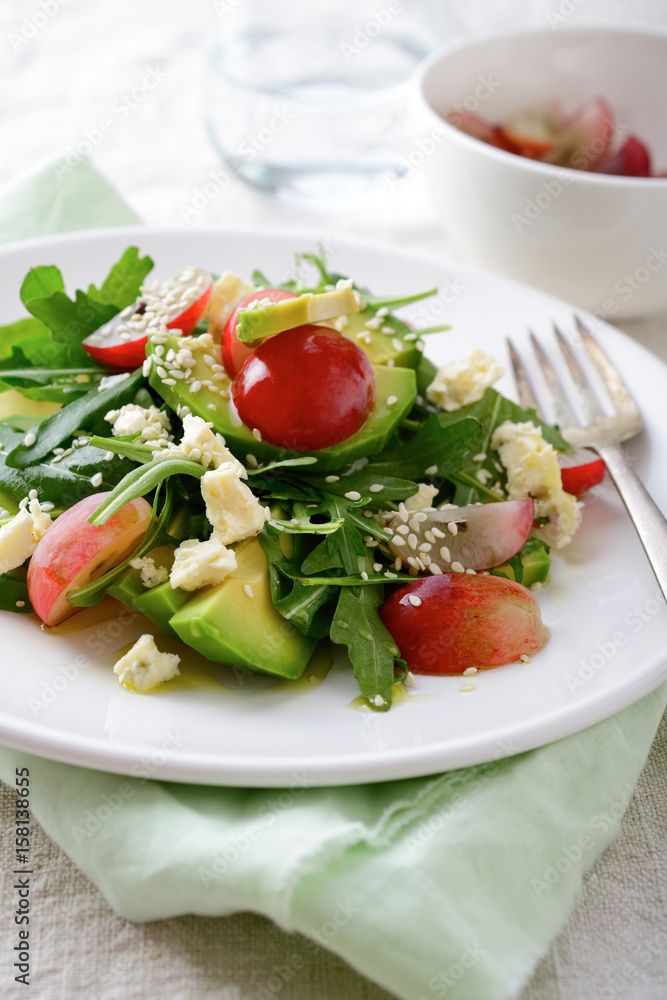 Salad with Avocado, Grapes, Arugula, Cheese and Sesame