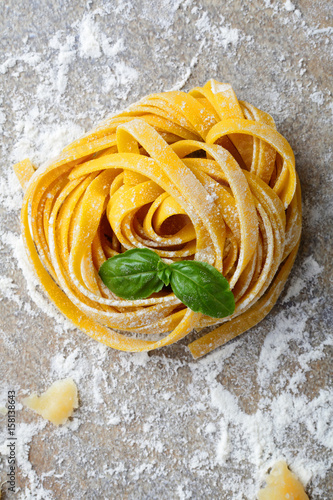 Tagliatelle italian pasta and basil closeup