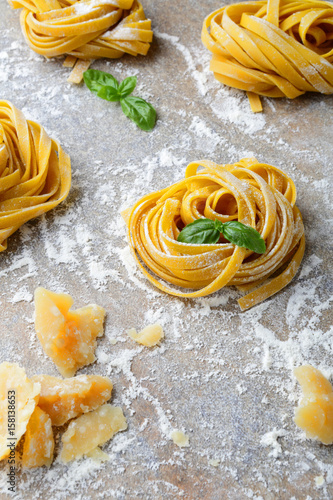 Italian pasta tagliatelle, parmesan and basil