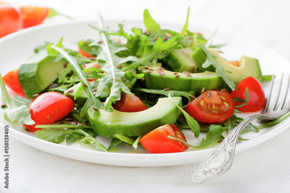 Fresh Salad with avocado, cherry tomatoes and arugula Fresh Salad with avocado, cherry tomatoes and arugula