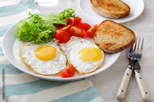 Breakfast - Fried Eggs, bread, tomato and lettuce