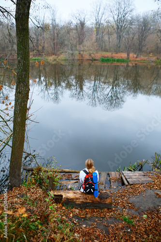 Woman hiker relax on the riverbank © Oleksandr Shevchenko