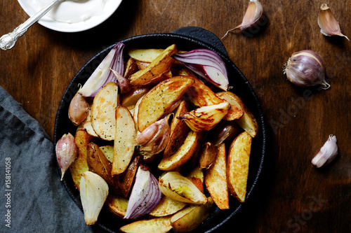 Baked potatoes with onion and garlic