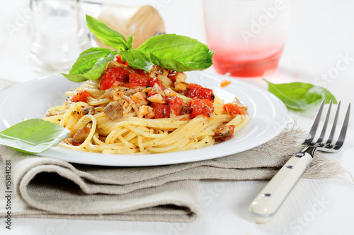 Tasty spaghetti with tomato sauce and mushrooms