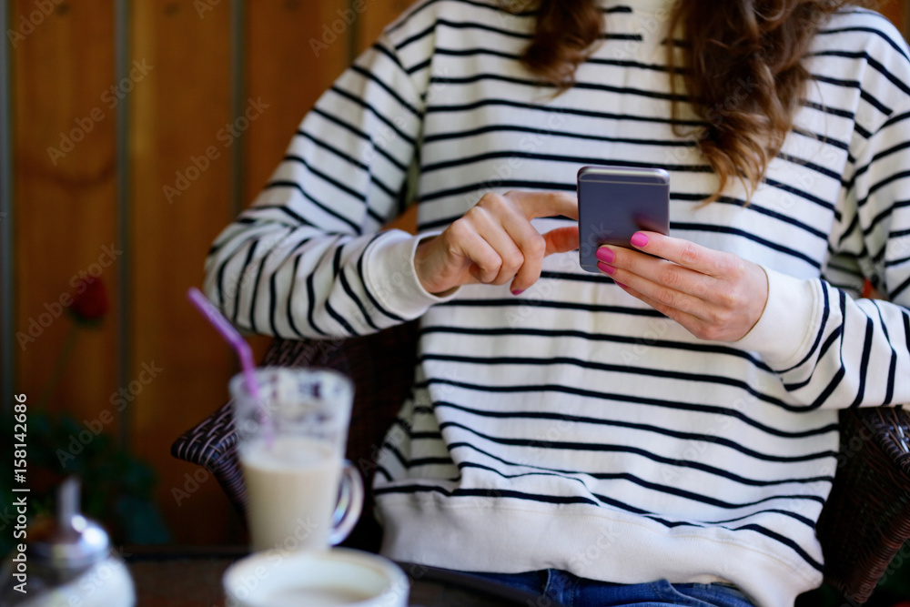 Woman with a smartphone in her hands Woman with a smartphone in her hands
