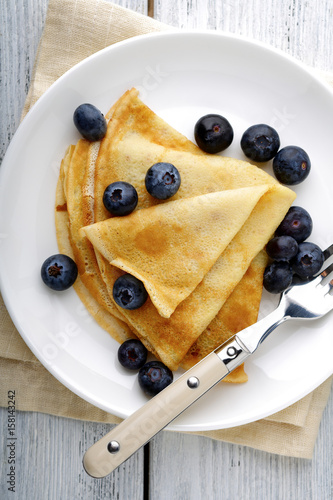 Crepes with blueberries on a plate