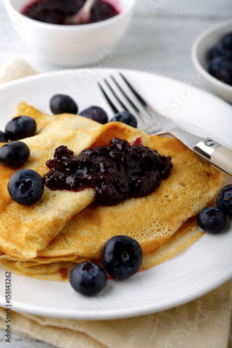 Delicious crepes with jam on a plate