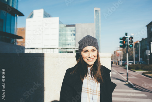 Portrait of young woman looking camera smiling - positive, attitude, getting away from it all concept