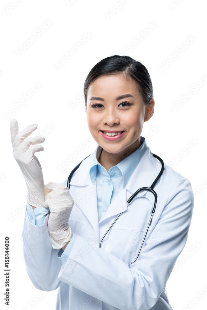 portrait of smiling doctor wearing protective gloves and looking at camera isolated on white portrait of smiling doctor wearing protective gloves and looking at camera isolated on white