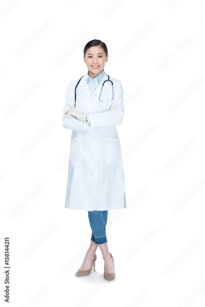 smiling doctor in lab coat with arms crossed looking at camera isolated on white smiling doctor in lab coat with arms crossed looking at camera isolated on white