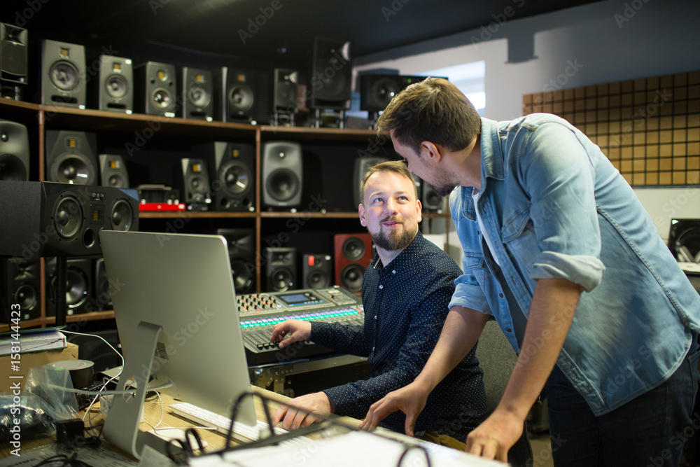 People discussing in music studio People discussing in music studio