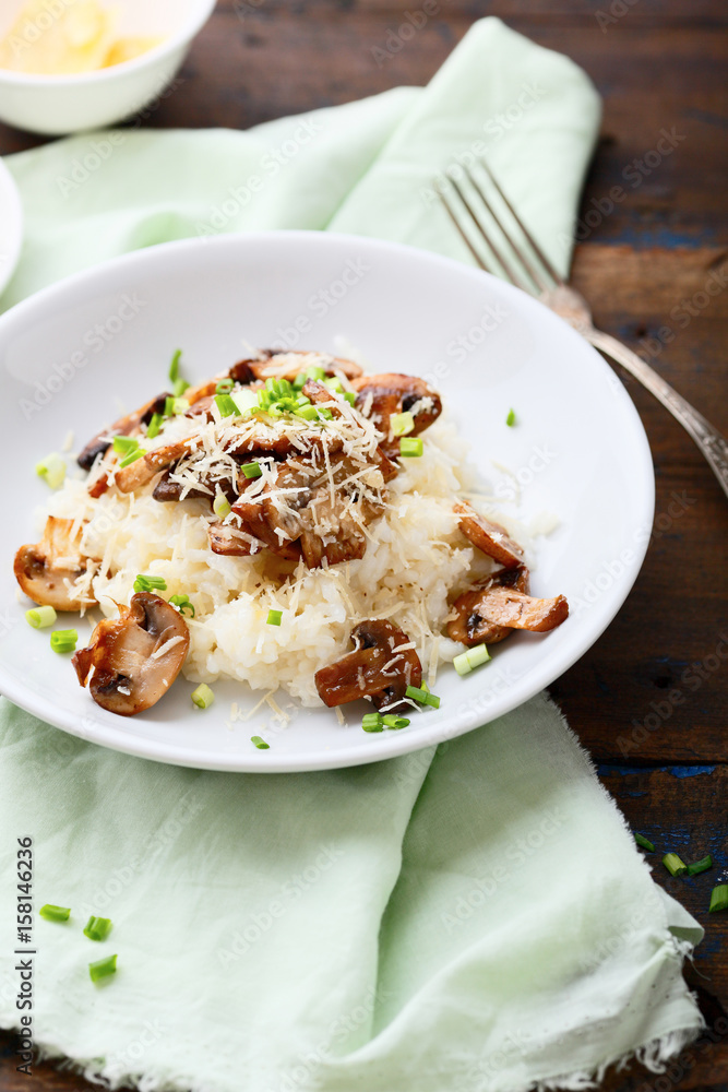 Tasty Risotto with mushrooms on white plate Tasty Risotto with mushrooms on white plate