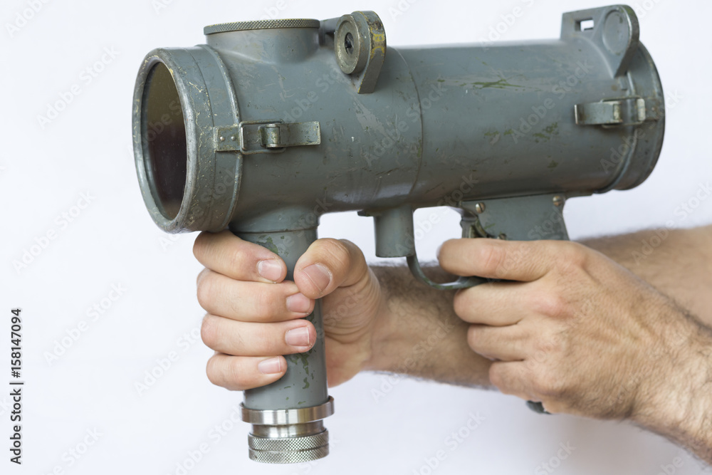 Naval vintage signal light gun for communication hold by man Stock