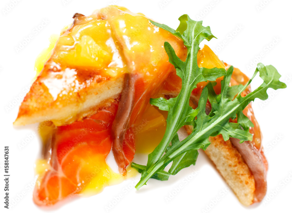 French breakfast the toast with an egg, salmon and orange sauce French breakfast the toast with an egg, salmon and orange sauce