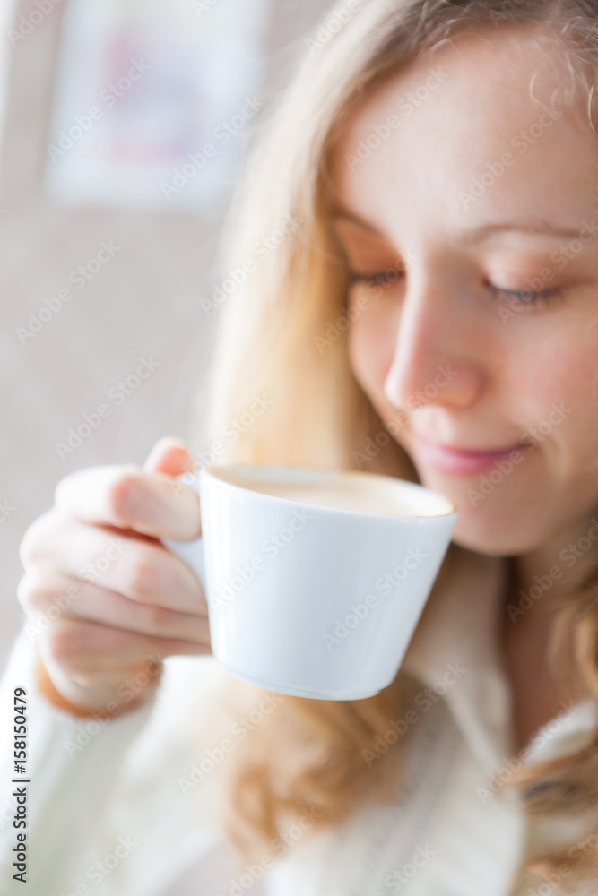 Coffee. Beautiful smiling girl holding in hand a cup of coffee Coffee. Beautiful smiling girl holding in hand a cup of coffee
