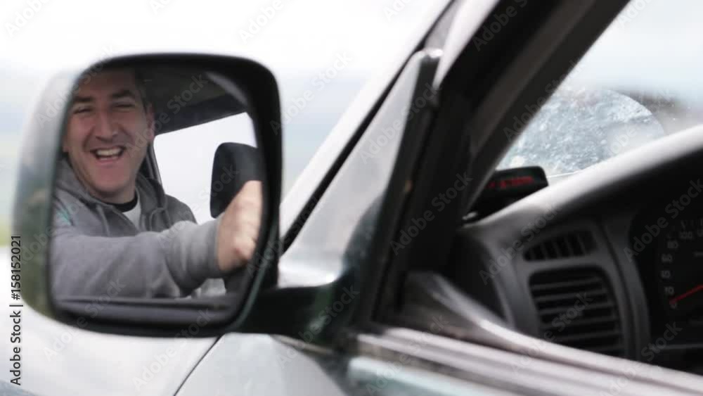 Man holding hand microphon and talking on radio in his car. Man holding hand microphon and talking on radio in his car.