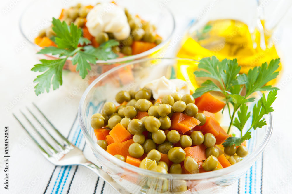 Vegetarian salad with canned peas and boiled vegetables close-up Vegetarian salad with canned peas and boiled vegetables close-up