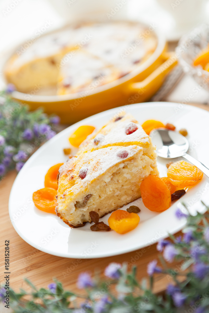 Cheese cake with dried apricot and raisins close-up