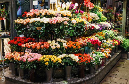 Street flower shop with colourful flowers © EdNurg