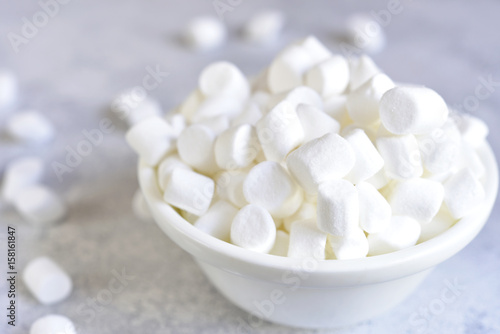 Mini marshmallow in a white bowl.