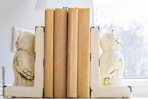 Old books on windowsill photo