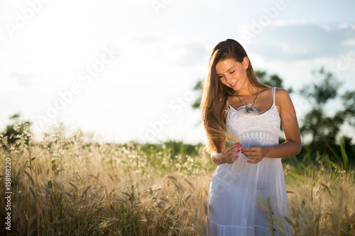 Beautiful carefree woman in fields
