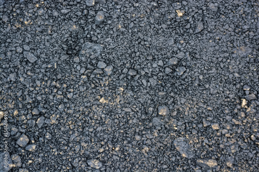 Abstract background of closeup dark uneven asphalt Abstract background of closeup dark uneven asphalt