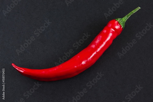 Red hot chili peppers on black background